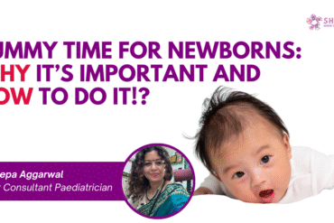 Newborn baby lying on tummy on a soft mat, lifting head during supervised tummy time.